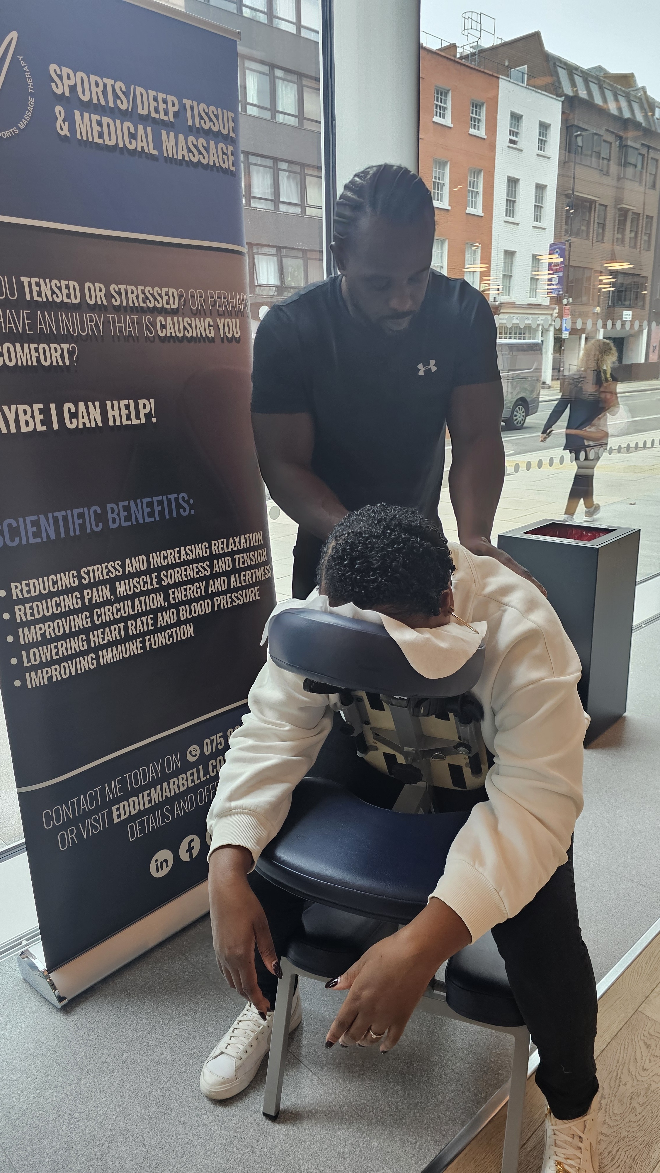 Eddie Marbell giving a workplace chair massage